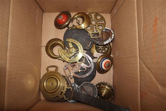 A group of horse brasses